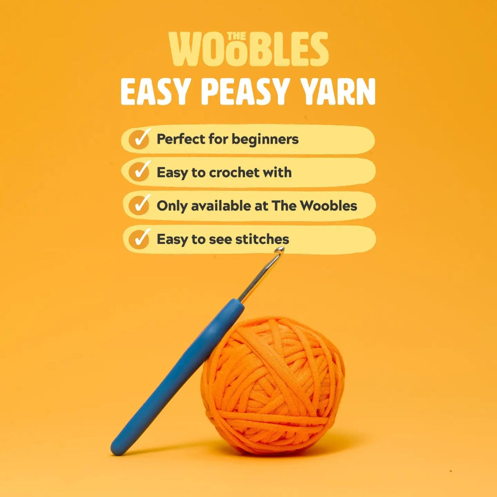 Orange yarn ball with a blue crochet hook on an orange background with 'Woobles' branding.