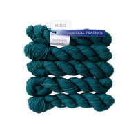 Teal yarn skeins with a label on a white background