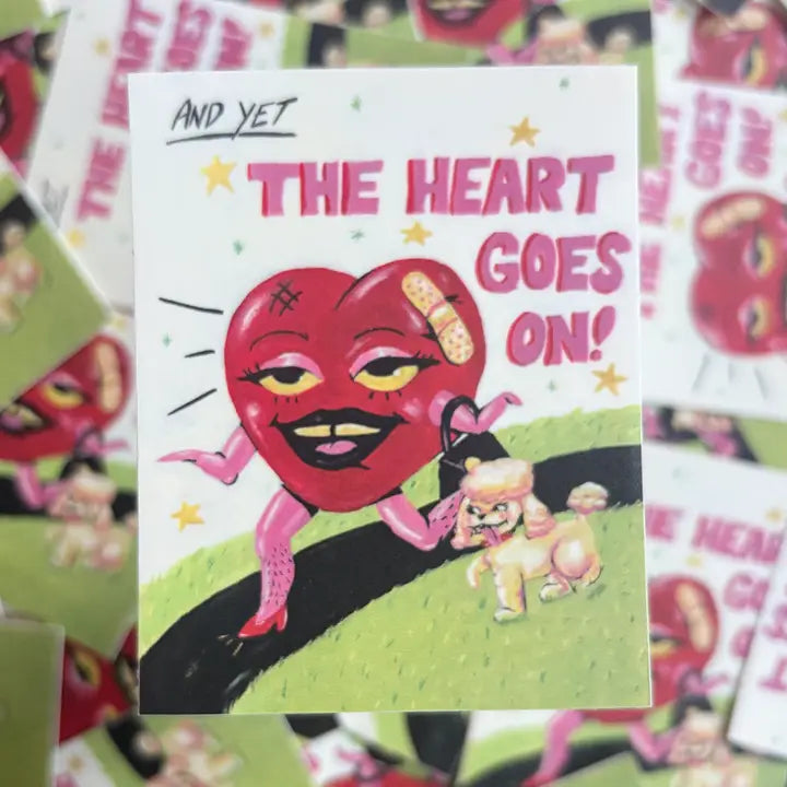 Square sticker featuring a red heart with arms and legs walking with a poodle and the text "And yet the heart goes on!"