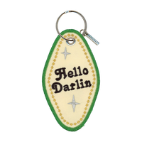 Embroidered motel-style keychain that reads "hello darlin" with a gold border