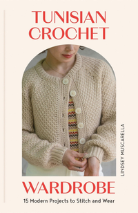 Woman in a white tunisian crocheted sweater with a patterned shirt underneath on a cream background with red writing stating "Tunisian Crochet Wardrobe"