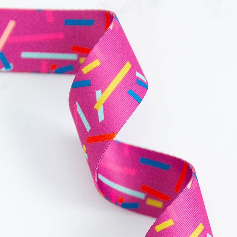 Purple-ish webbing with multi colored confetti strips