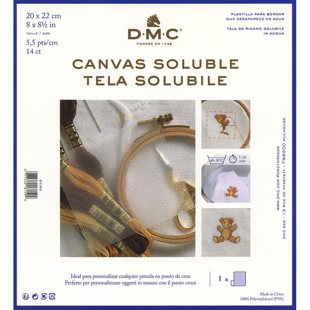 D-M-C Canvas Soluble embroidery thread package, featuring a cream-colored background with blue borders, product details in Spanish and Portuguese, and three demonstration photos showing finished embroidered designs.
