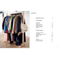 Clothing rack with various garments and a beige handbag on a white background with Table Of Contents.