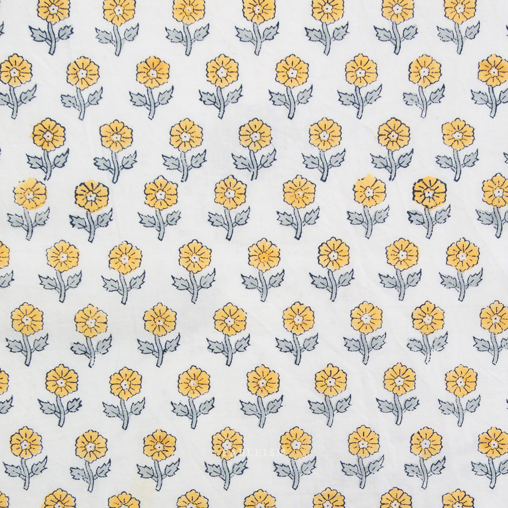 Pattern of yellow flowers with green stems on a white background