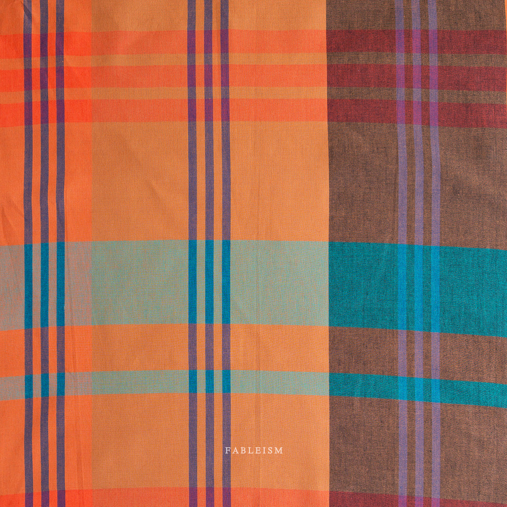 Plaid fabric with orange, blue and teal colors