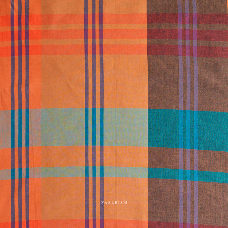 Plaid fabric with orange, blue and teal colors